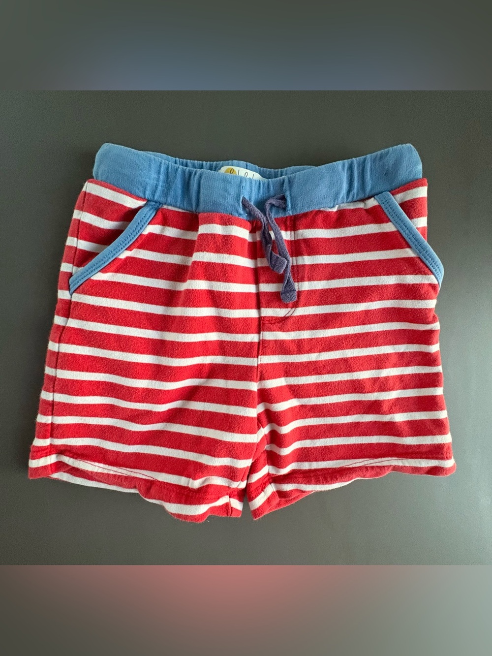 Baby Boden Red and White Striped Shorts with Blue Waistband